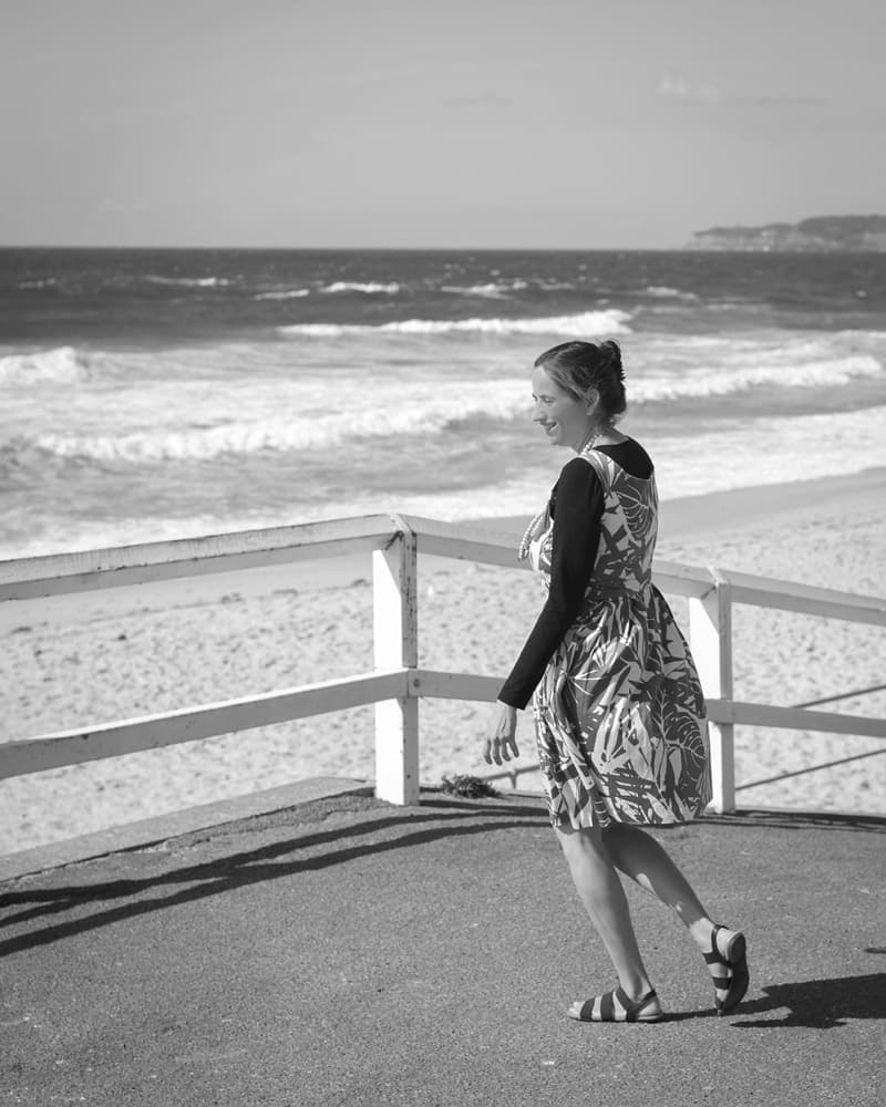 Melanie Suzanne Wilson walking in black and white