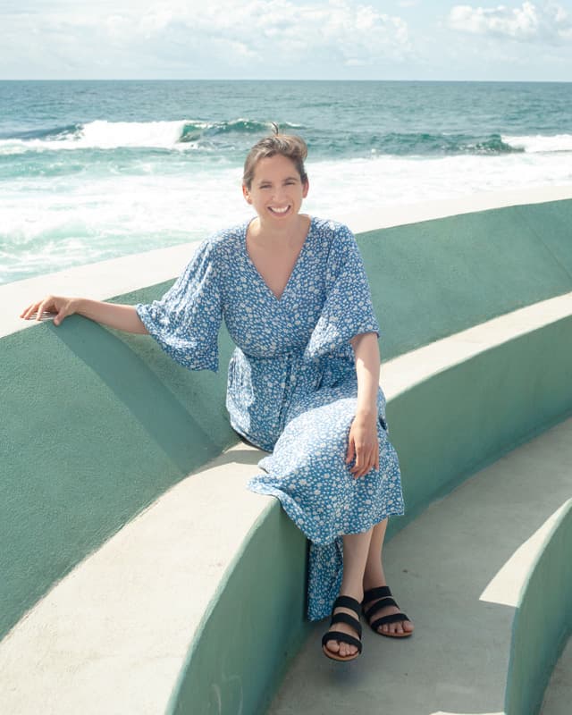 Melanie Suzanne Wilson on beach stairs